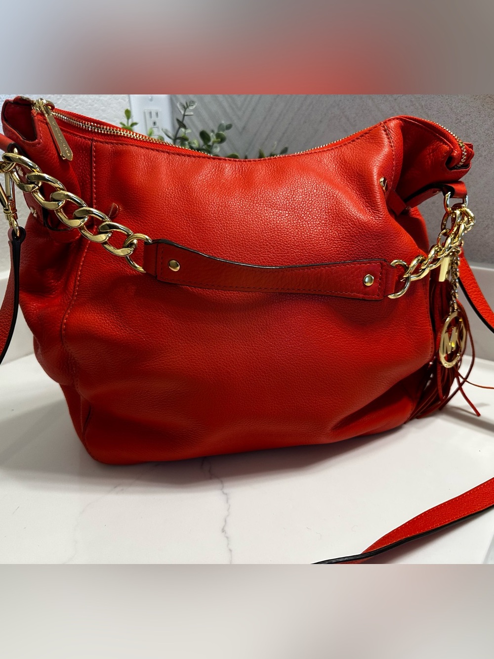 MICHAEL KORS Orange Leather Shoulder Bag with Gold Chain and Tassel Accent